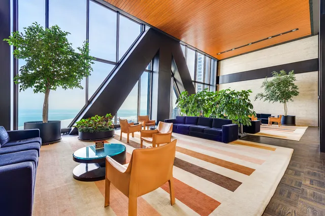 a view of a chairs and table in the patio