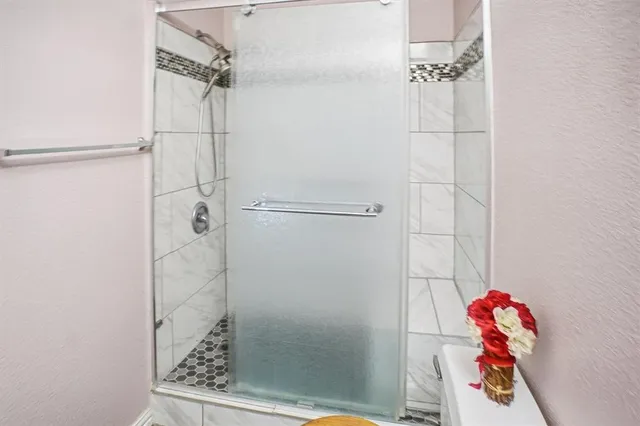 a kitchen with stainless steel appliances granite countertop a sink and a granite counter tops