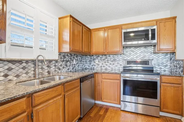 a living room with furniture and a ceiling fan