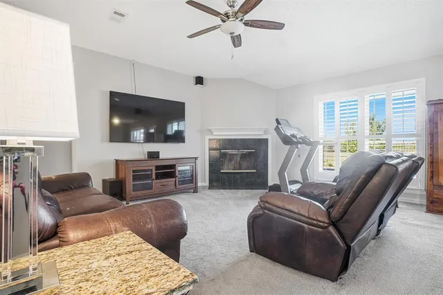 a bathroom with a granite countertop sink a mirror and a bathtub