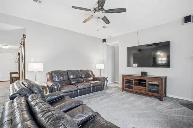 a bathroom with a granite countertop sink a mirror and vanity