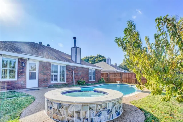 a bedroom with a bed and ceiling fan