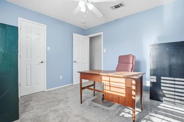 a living room with furniture and windows