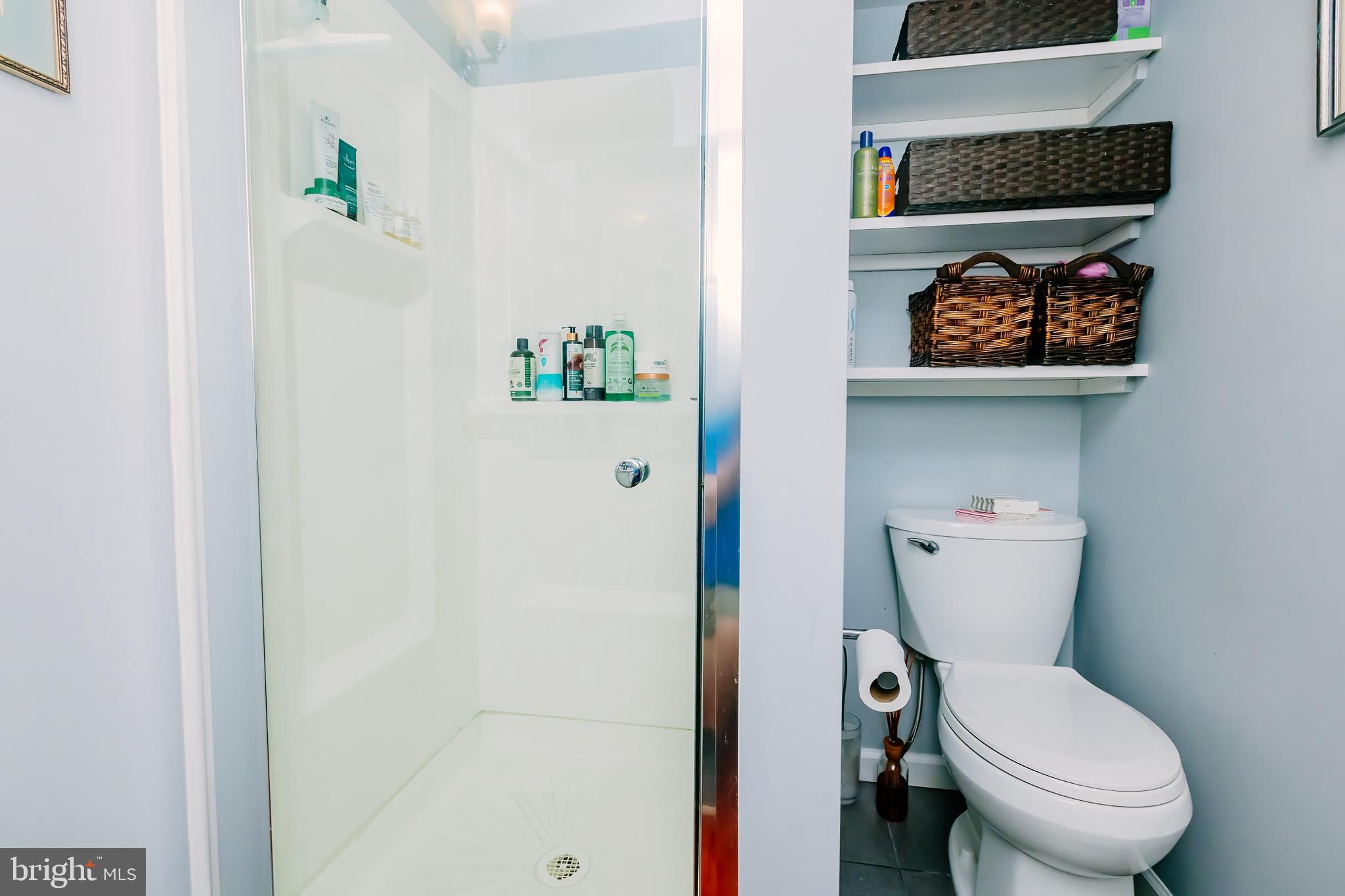 1091 Highland Road Newtown, PA 18940 - Photo 106 of 128 a white toilet sitting next to a bathroom sink