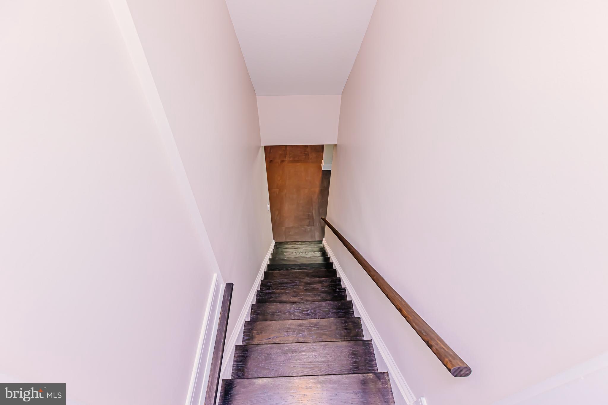 1091 Highland Road Newtown, PA 18940 - Photo 108 of 128 a view of a hallway with wooden floor