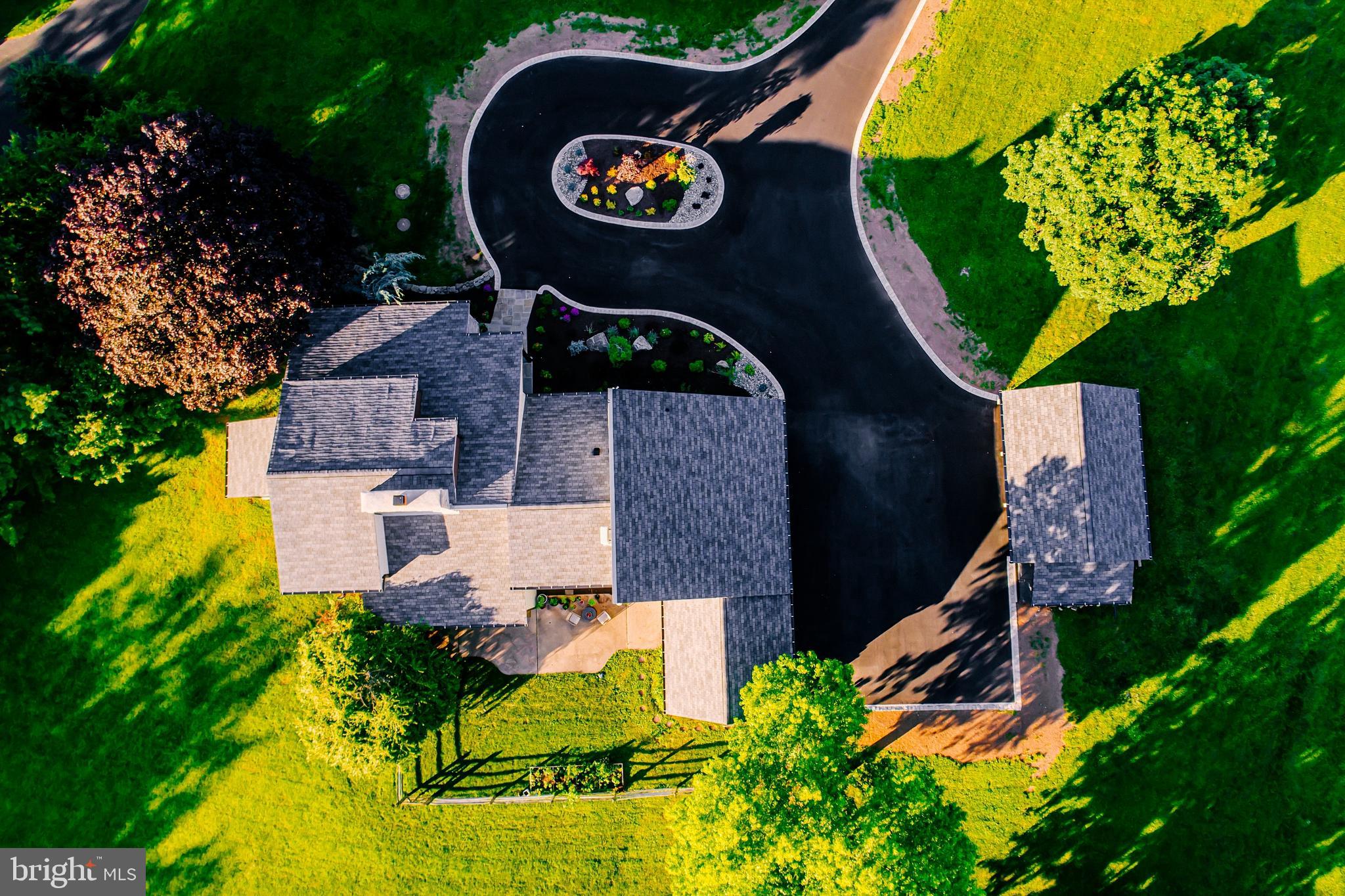 1091 Highland Road Newtown, PA 18940 - Photo 122 of 128 an aerial view of a house with garden space sitting space and swimming pool