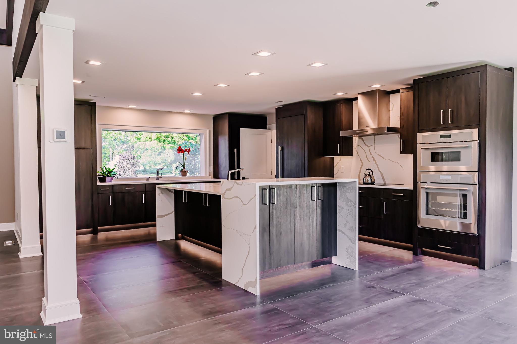 1091 Highland Road Newtown, PA 18940 - Photo 32 of 128 a kitchen with stainless steel appliances kitchen island granite countertop a refrigerator and a sink