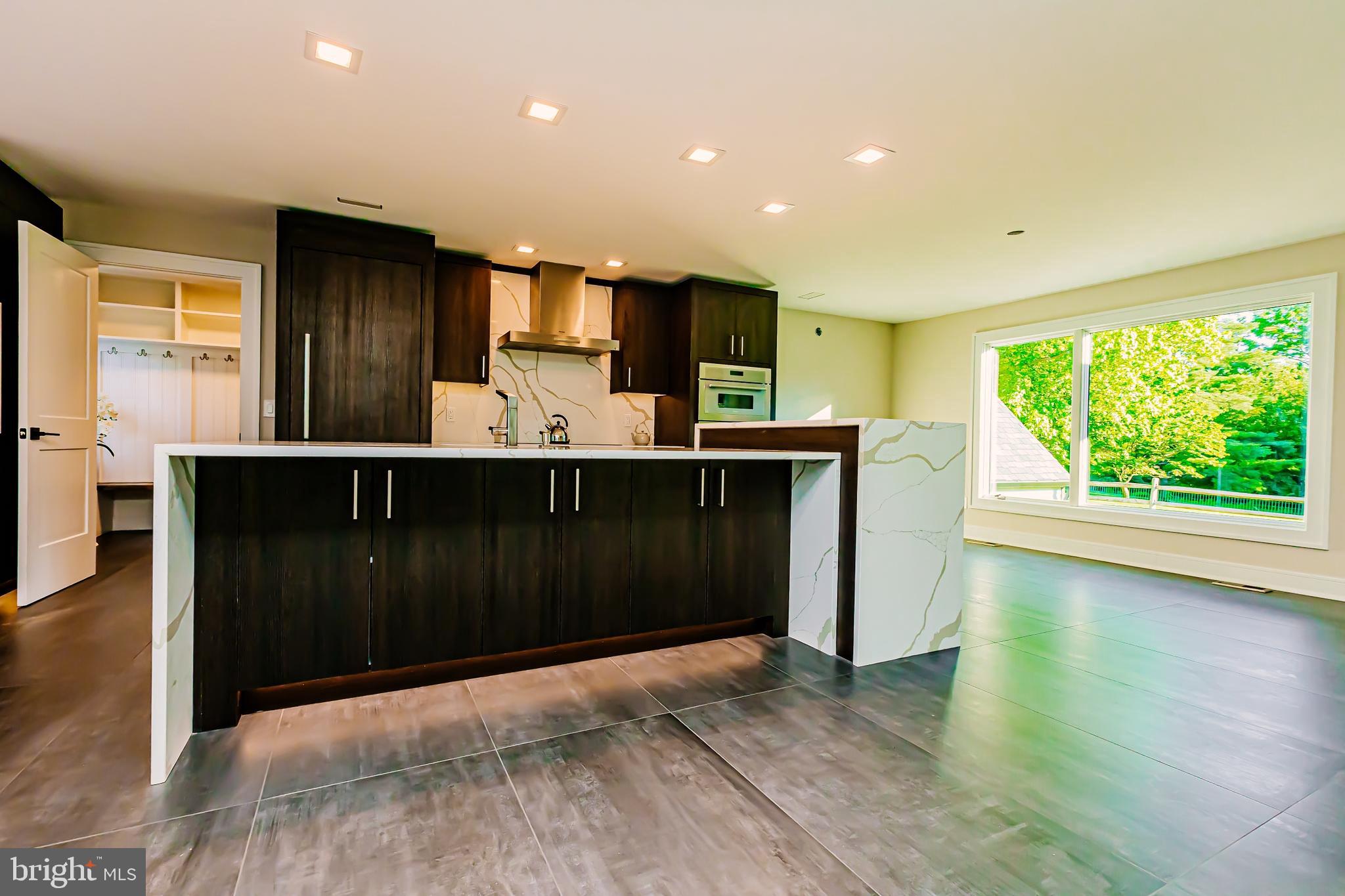 1091 Highland Road Newtown, PA 18940 - Photo 35 of 128 a kitchen with kitchen island a sink stainless steel appliances and cabinets