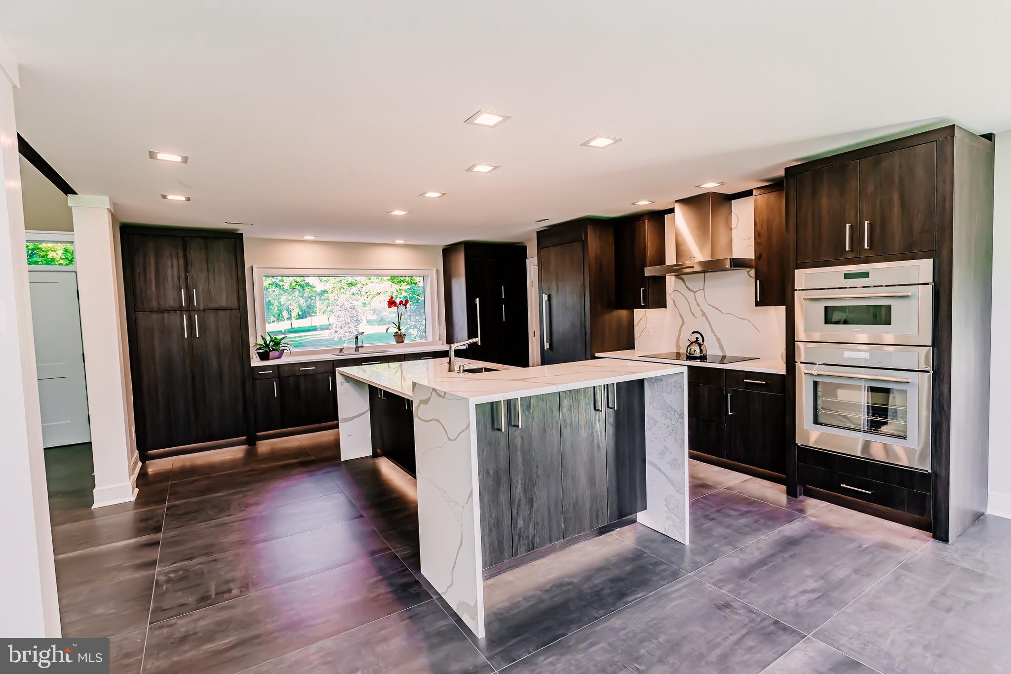 1091 Highland Road Newtown, PA 18940 - Photo 46 of 128 a kitchen with stainless steel appliances kitchen island granite countertop a stove a refrigerator and a oven