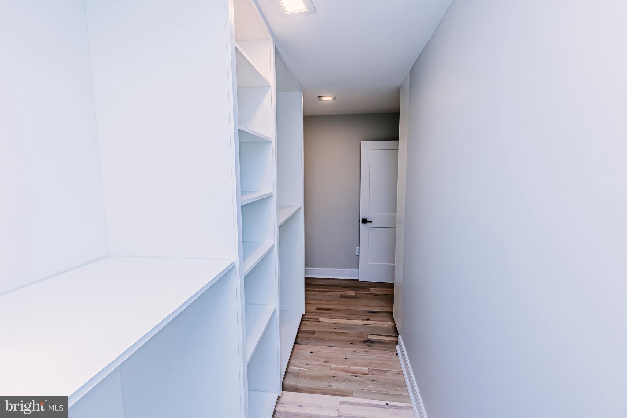 1091 Highland Road Newtown, PA 18940 - Photo 72 of 128 a view of a hallway with wooden floor and staircase