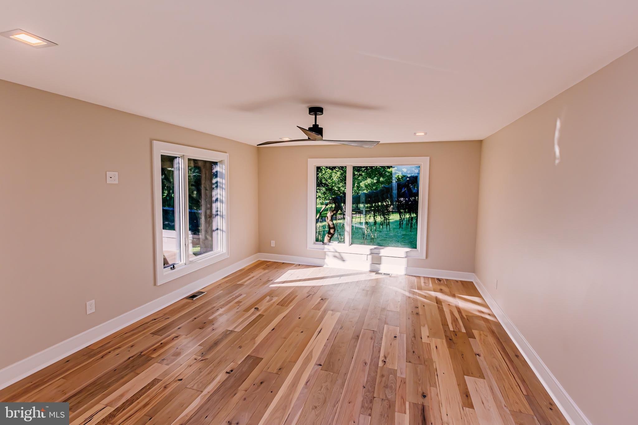 1091 Highland Road Newtown, PA 18940 - Photo 73 of 128 a view of an empty room with wooden floor and a window