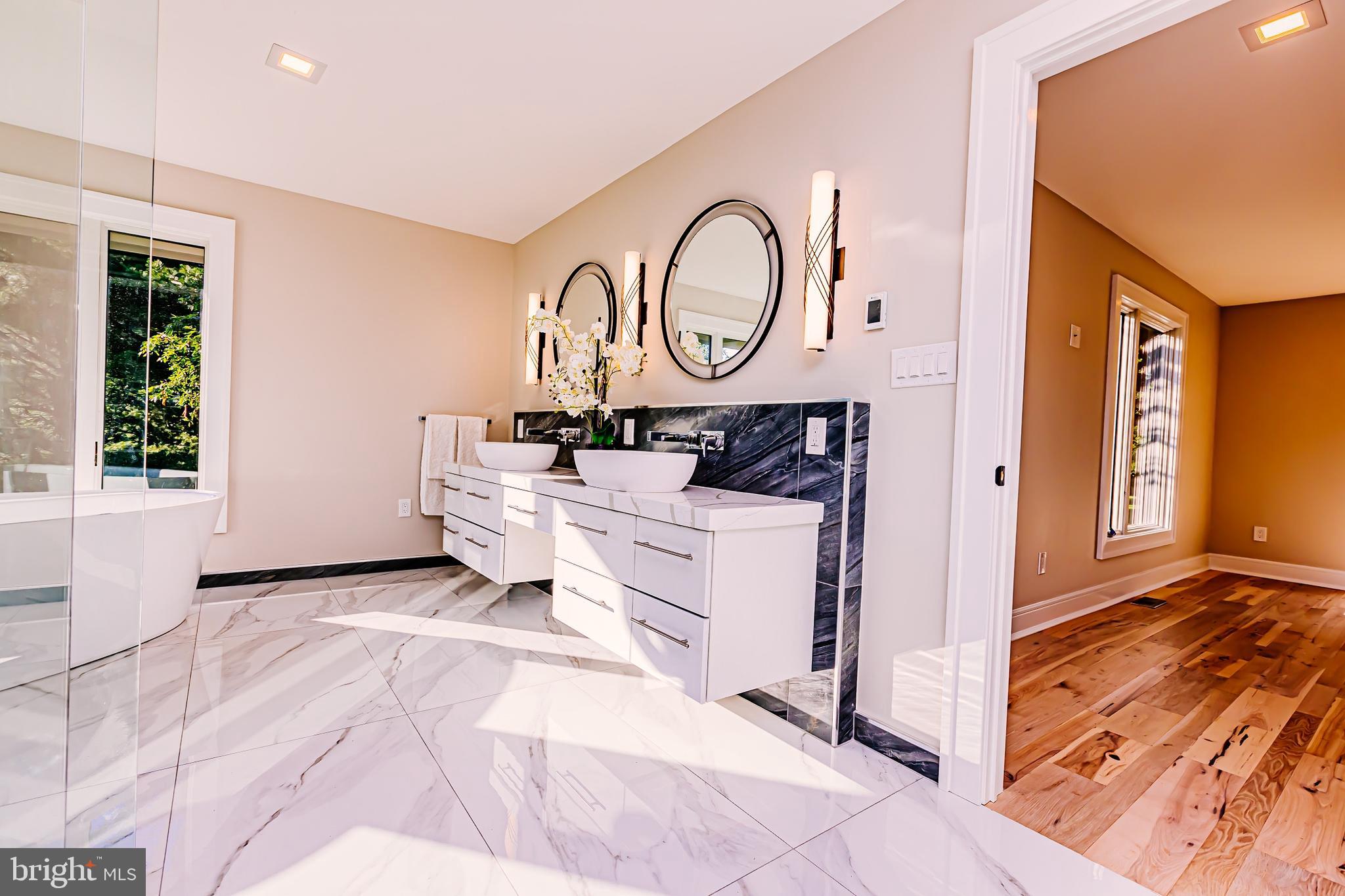 1091 Highland Road Newtown, PA 18940 - Photo 79 of 128 a view of a hallway with entryway wooden floor and front door