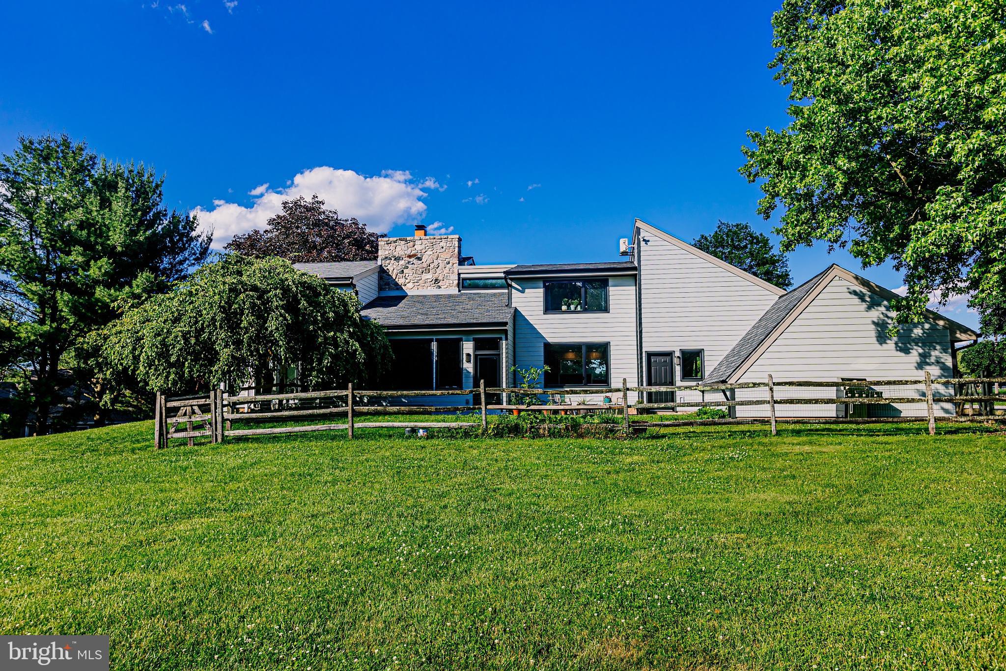 1091 Highland Road Newtown, PA 18940 - Photo 9 of 128 a view of a house with a yard porch and sitting area