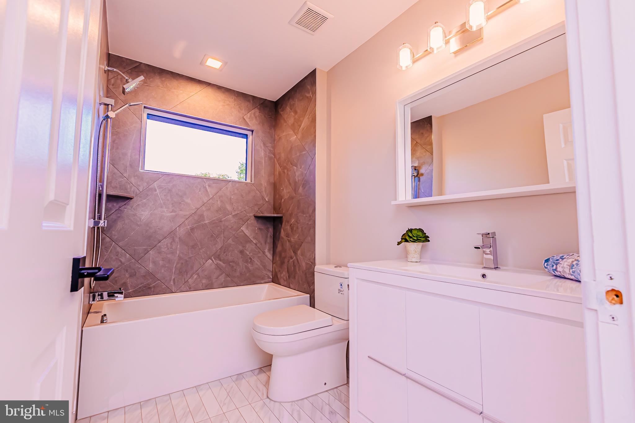 1091 Highland Road Newtown, PA 18940 - Photo 97 of 128 a bathroom with a sink a toilet and shower