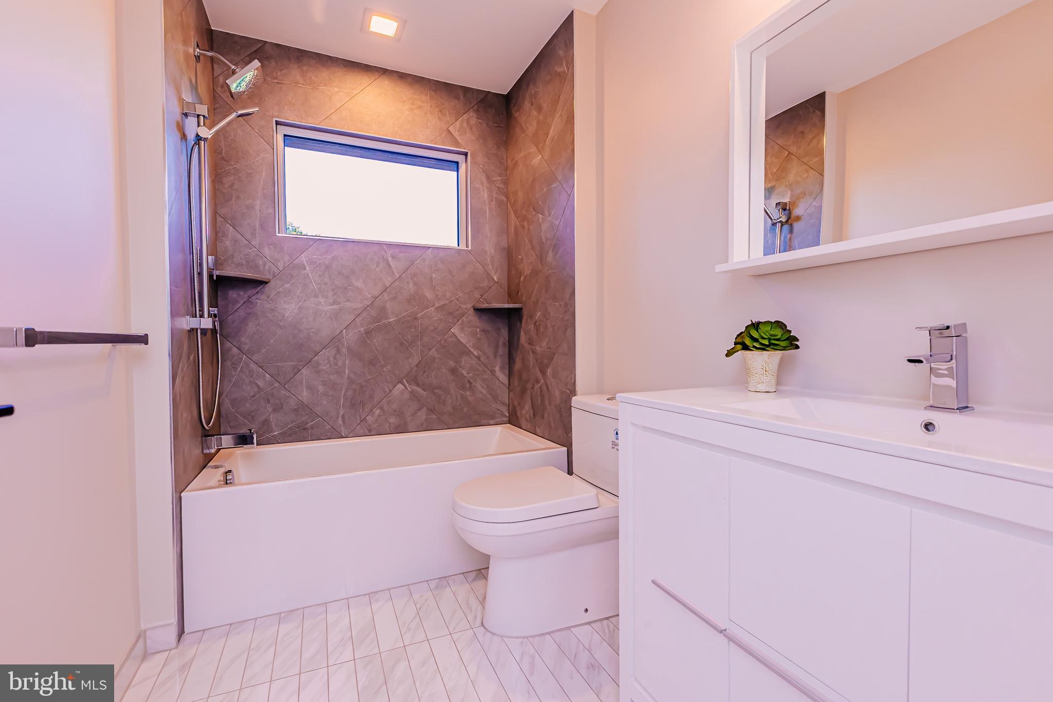 1091 Highland Road Newtown, PA 18940 - Photo 99 of 128 a bathroom with a sink a toilet and shower