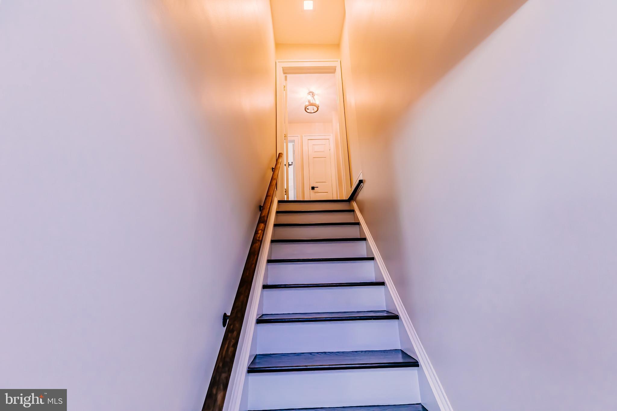 1091 Highland Road Newtown, PA 18940 - Photo 100 of 128 a view of a hallway with wooden floor and entryway