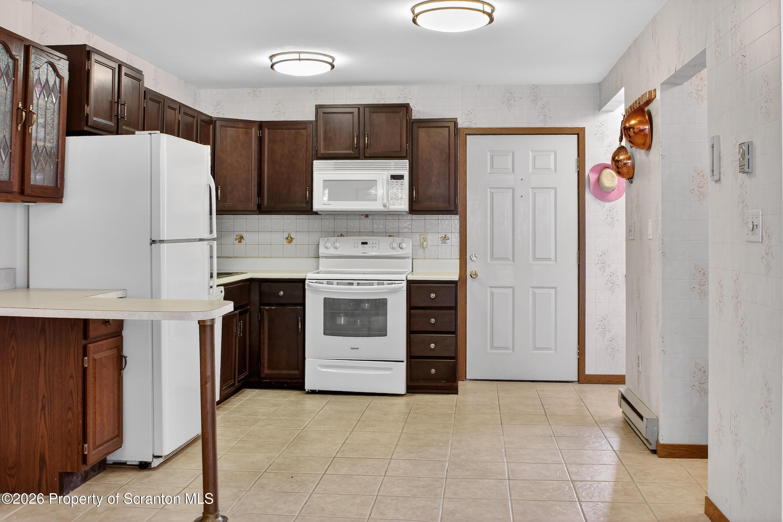 211 Falls Circle Bushkill, PA 18324 - Photo 2 of 28 a kitchen with stainless steel appliances a refrigerator sink and cabinets