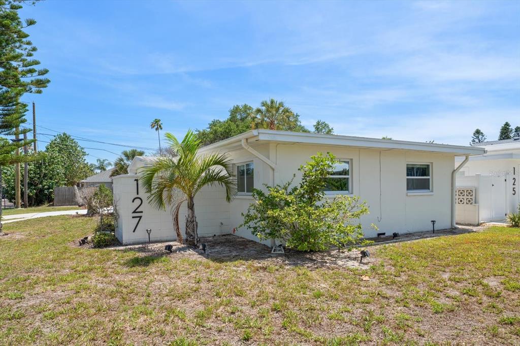 127 11th Avenue Indian Rocks Beach, FL 33785 - Photo 35 of 63 a view of a house with backyard and plants
