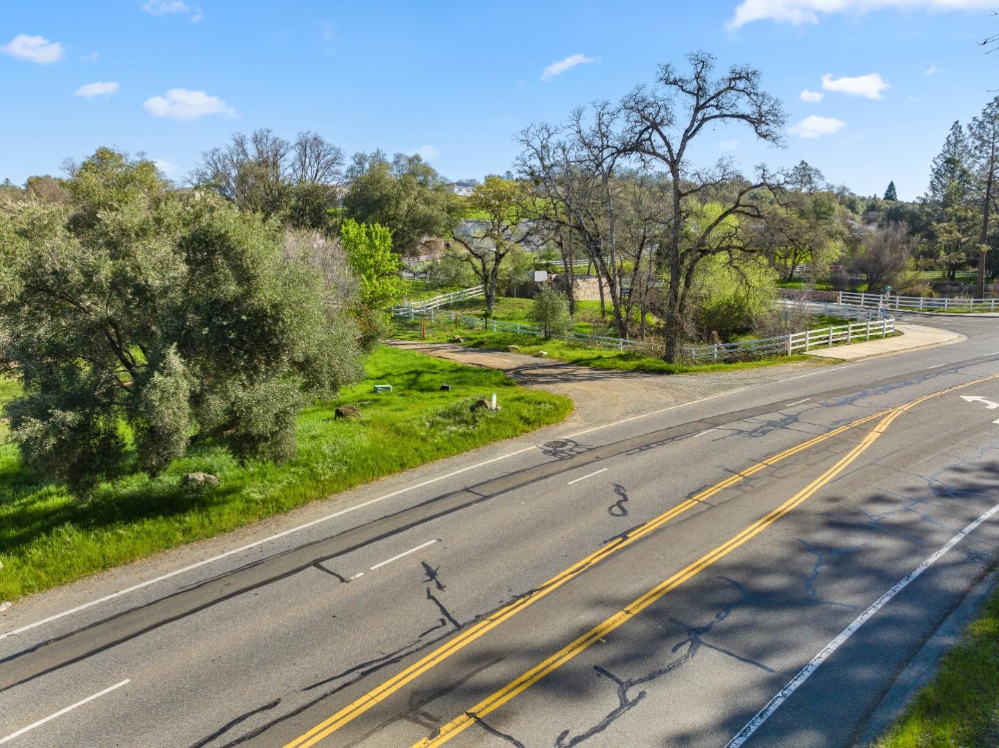 10264 Combie Road Grass Valley, CA 95949 - Photo 21 of 53 a view of a yard and a cars park on the road