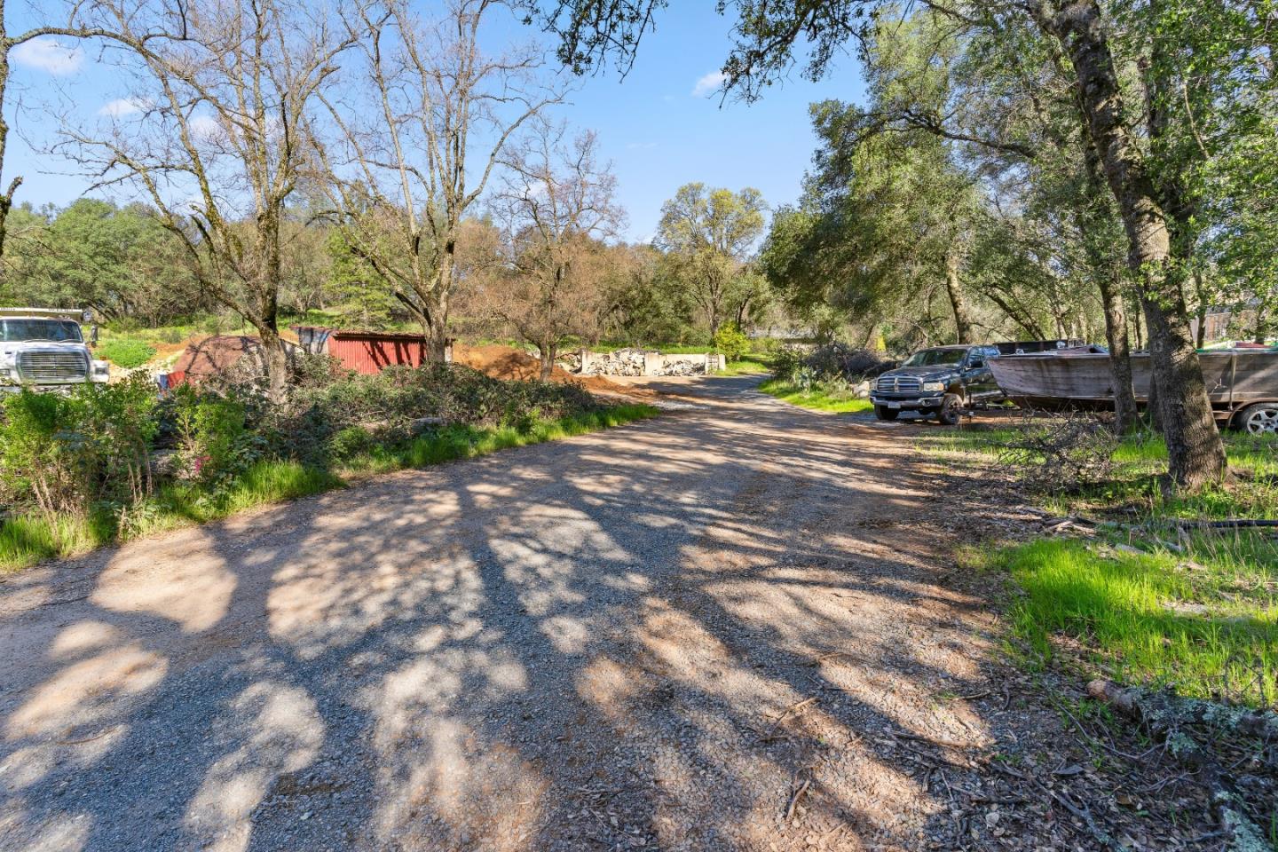 10264 Combie Road Grass Valley, CA 95949 - Photo 27 of 53 a view of a street with a yard and trees