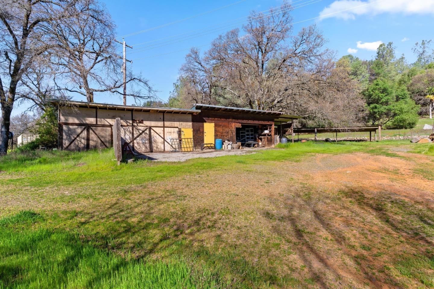 10264 Combie Road Grass Valley, CA 95949 - Photo 32 of 53 a view of a house with a yard and sitting area