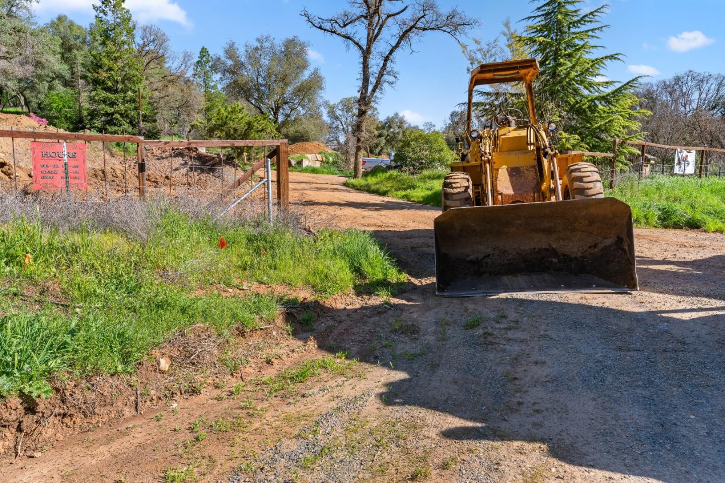 10264 Combie Road Grass Valley, CA 95949 - Photo 42 of 53 a view of a street with a bench and trees