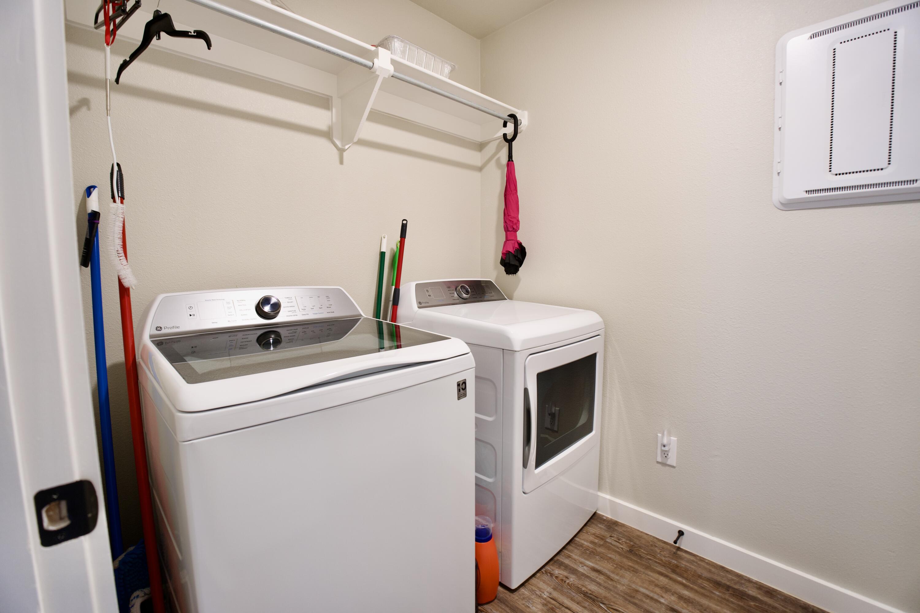 1913 134th Street Lubbock, TX 79423 - Photo 12 of 15 a utility room with dryer and washer