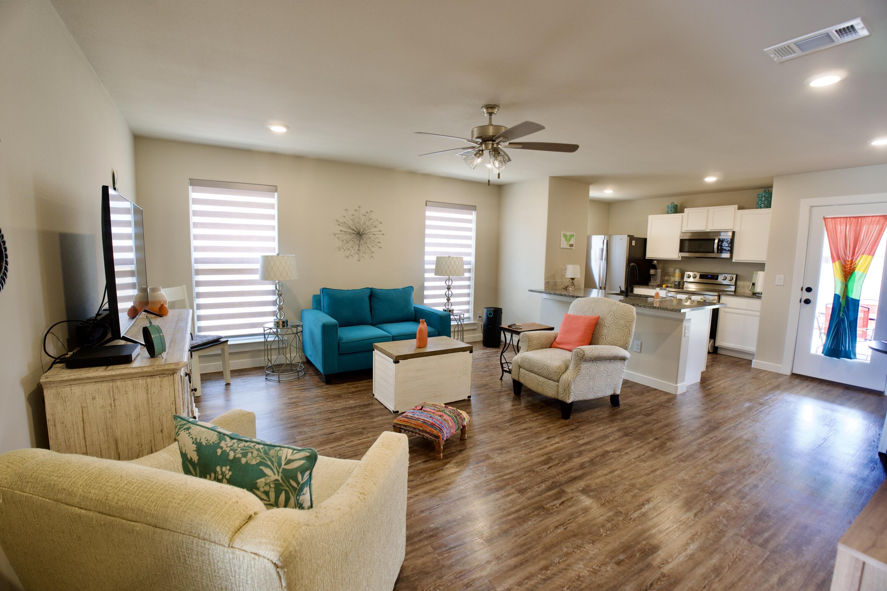 1913 134th Street Lubbock, TX 79423 - Photo 3 of 15 a living room with furniture and a flat screen tv