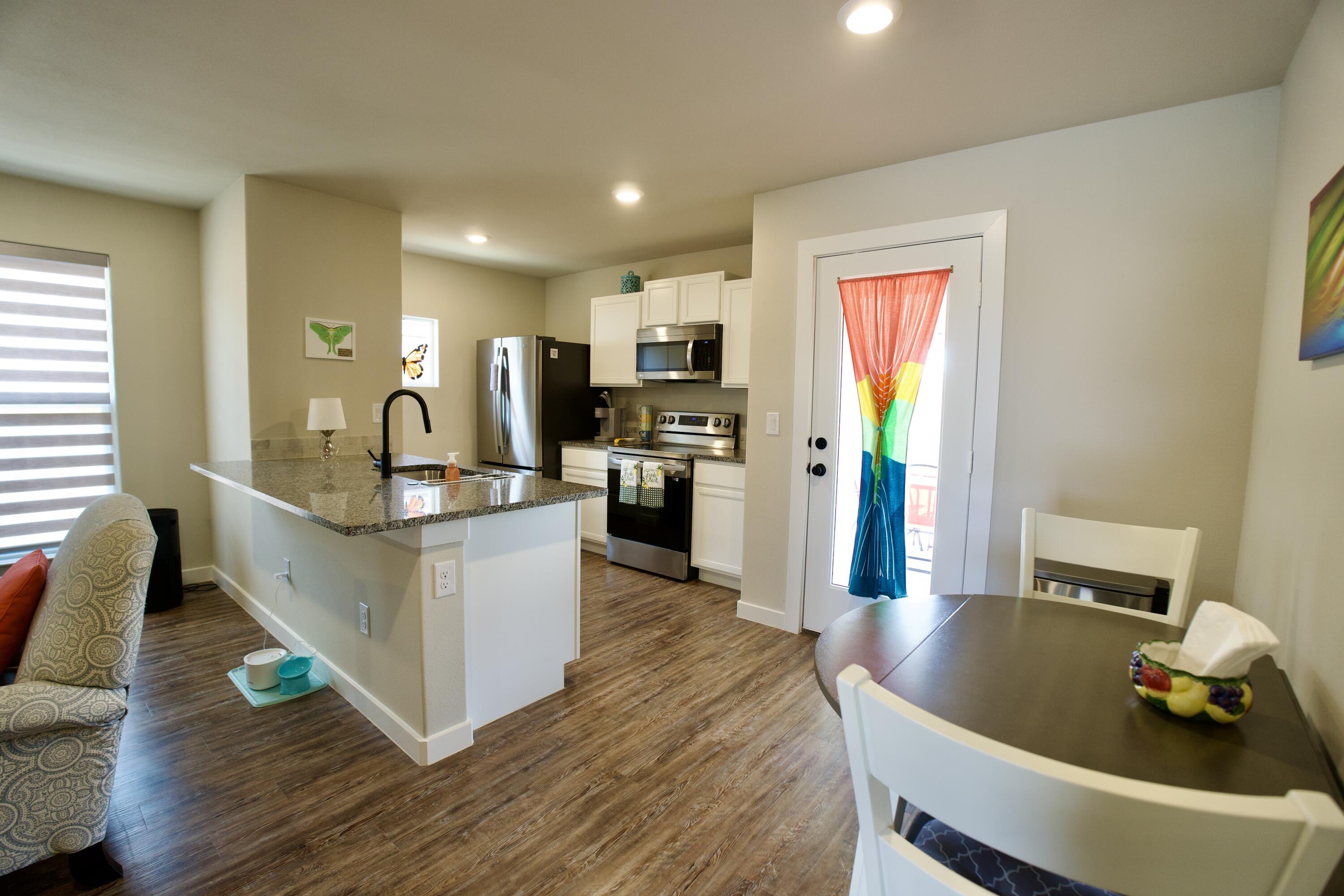 1913 134th Street Lubbock, TX 79423 - Photo 6 of 15 a living room with furniture and a wooden floor
