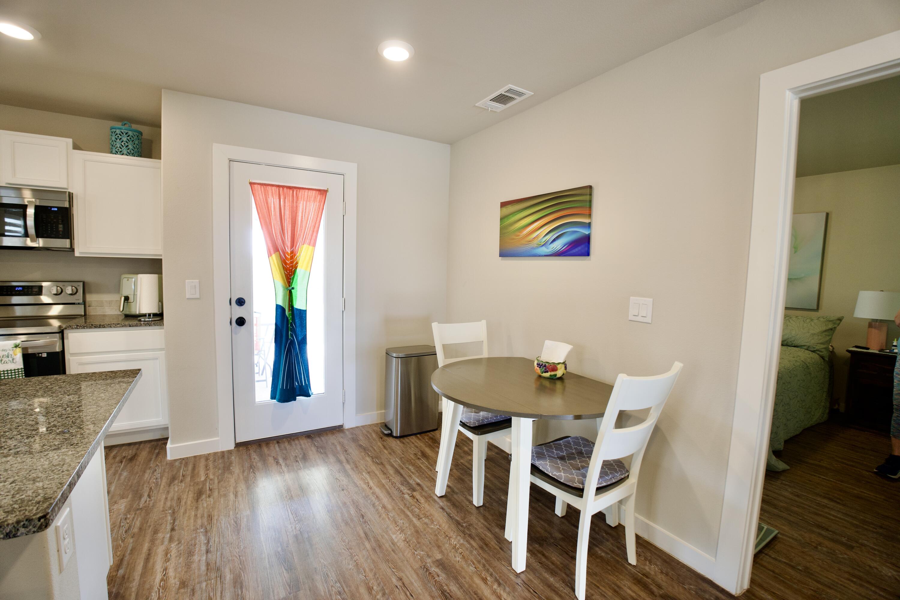 1913 134th Street Lubbock, TX 79423 - Photo 7 of 15 a view of a dining room with furniture and wooden floor
