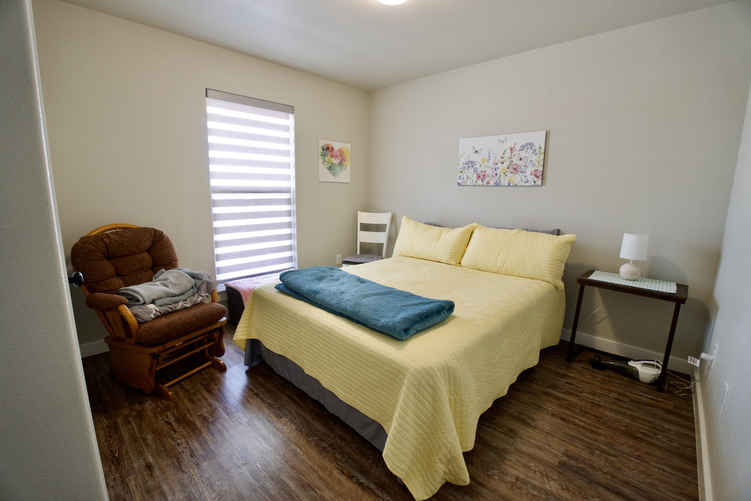 1913 134th Street Lubbock, TX 79423 - Photo 10 of 15 a bedroom with a bed and a couch