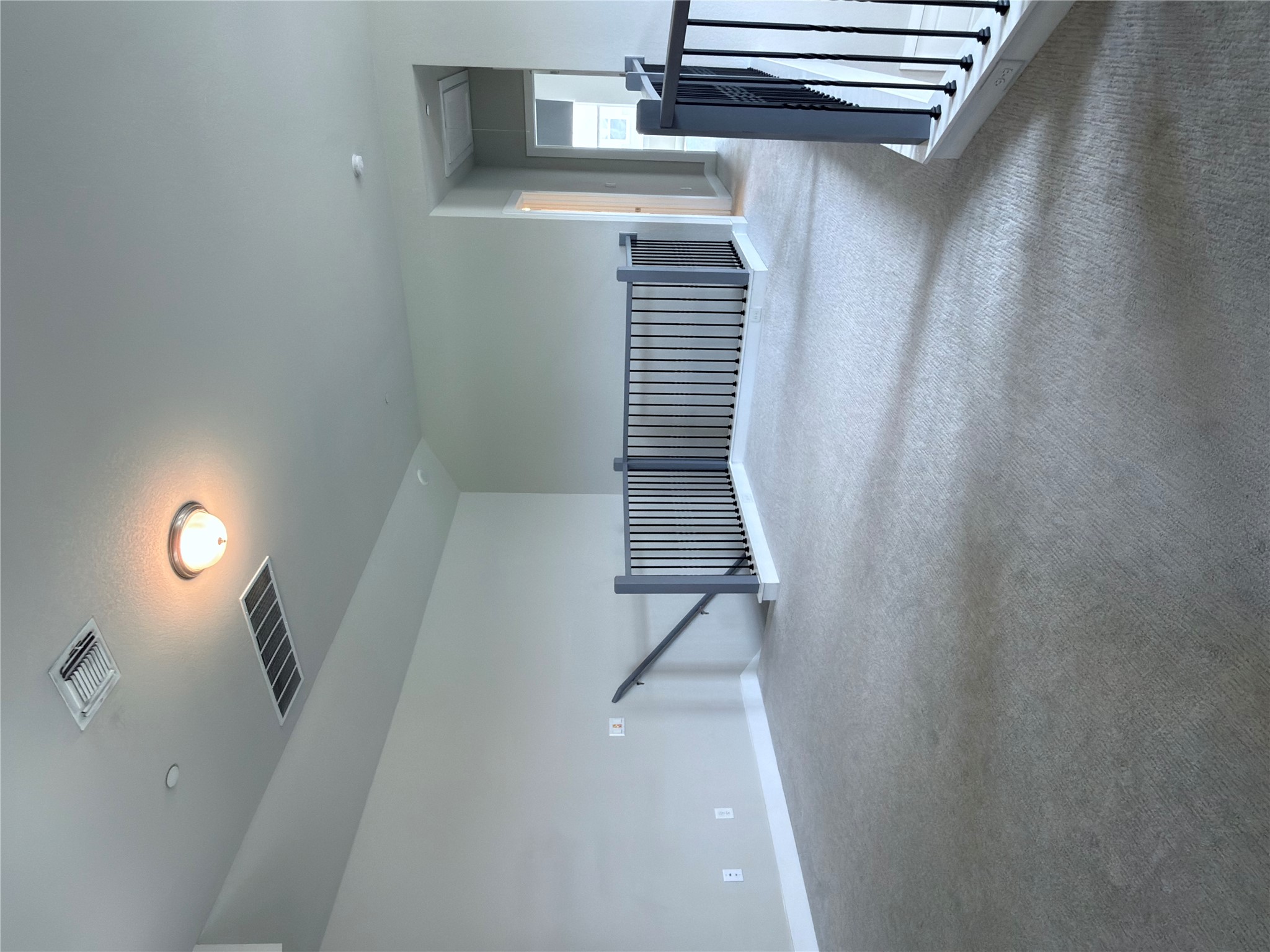 11216 Gadsen Lane Austin, TX 78754 - Photo 24 of 36 A spacious, naturally illuminated loft provides versatile living space, perfect for relaxation or recreation.