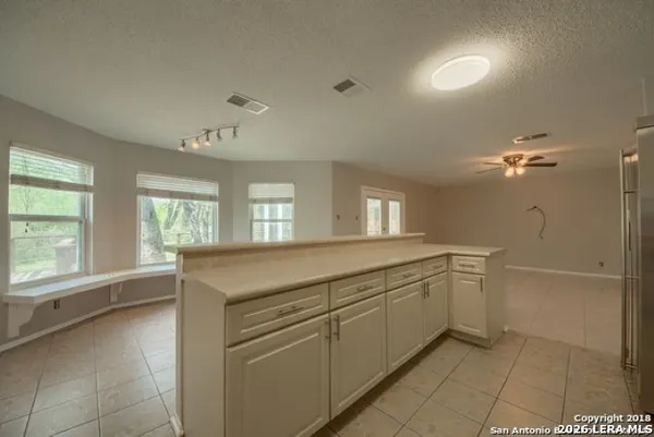 a room with a sink and cabinets