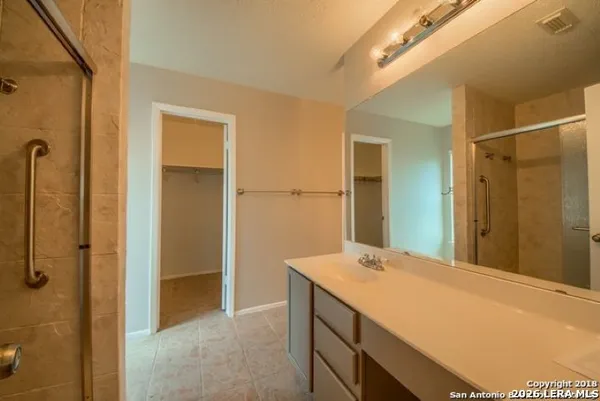 a bathroom with a sink and mirror