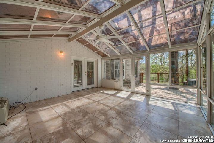 6911 Ridge Pl Street San Antonio, TX 78250 - Photo 22 of 22 a view of an empty room with a sliding door
