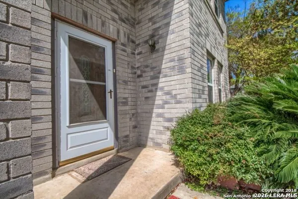 a view of house with backyard