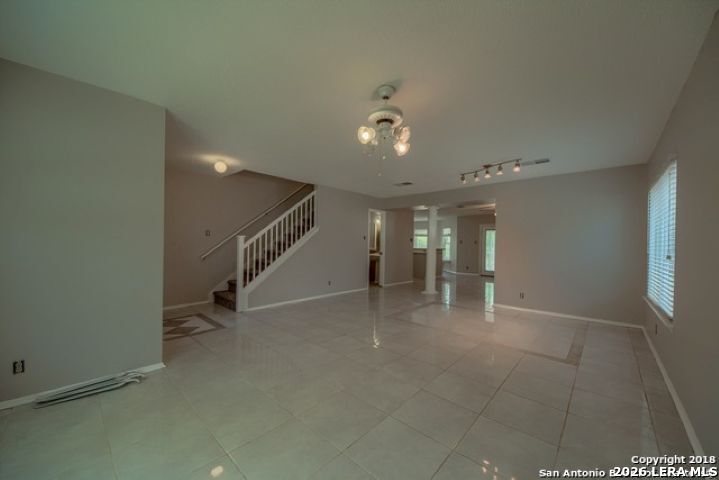 6911 Ridge Pl Street San Antonio, TX 78250 - Photo 6 of 22 a view of an empty room with stairs