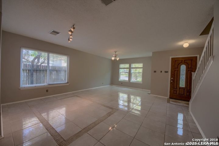 6911 Ridge Pl Street San Antonio, TX 78250 - Photo 7 of 22 a view of livingroom with furniture and windows