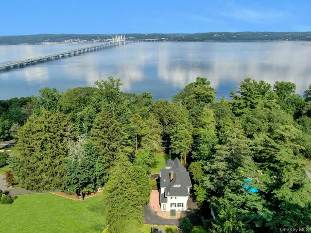 an aerial view of a houses with a lake view