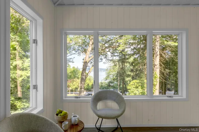 a living room filled with furniture and a window
