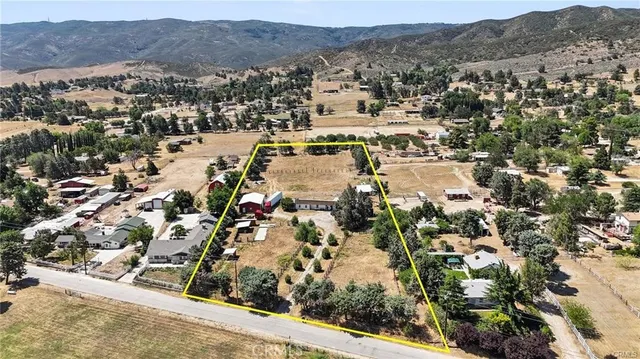 an aerial view of residential house and sandy dunes