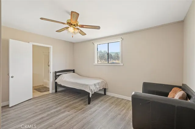 a bedroom with bed and window