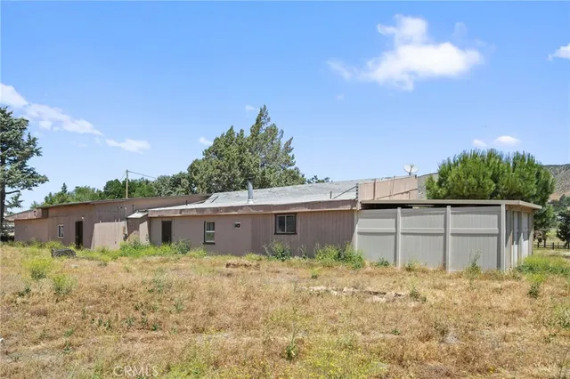 a house view with a backyard space