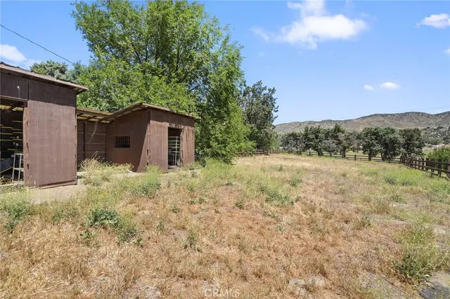 a view of a backyard of the house