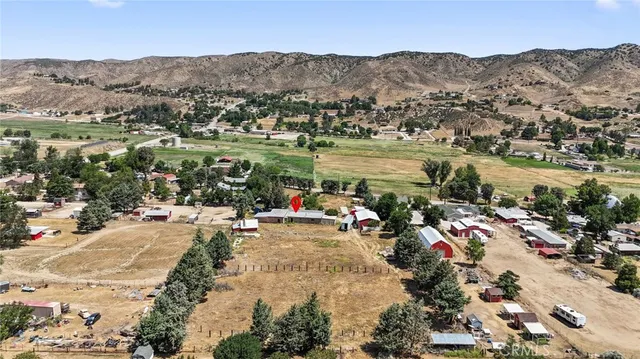 an aerial view of a town with couple of houses
