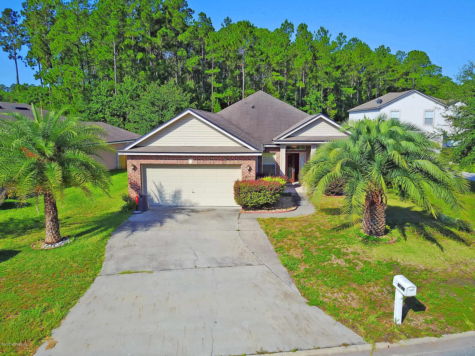9146 Raptor Drive Jacksonville, FL 32221 - Photo 1 of 26 a front view of a house with garden
