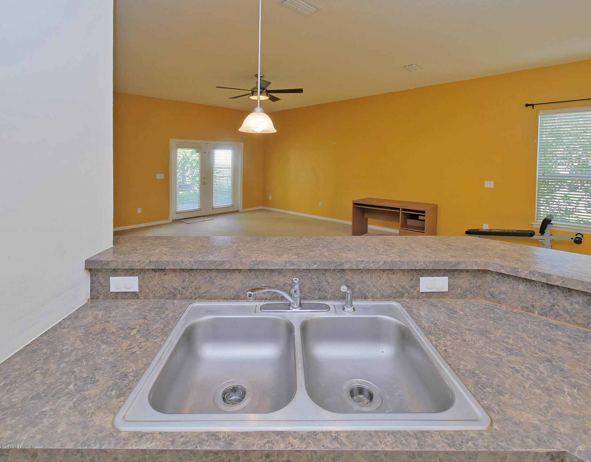 9146 Raptor Drive Jacksonville, FL 32221 - Photo 11 of 26 a bathroom with a sink and a mirror