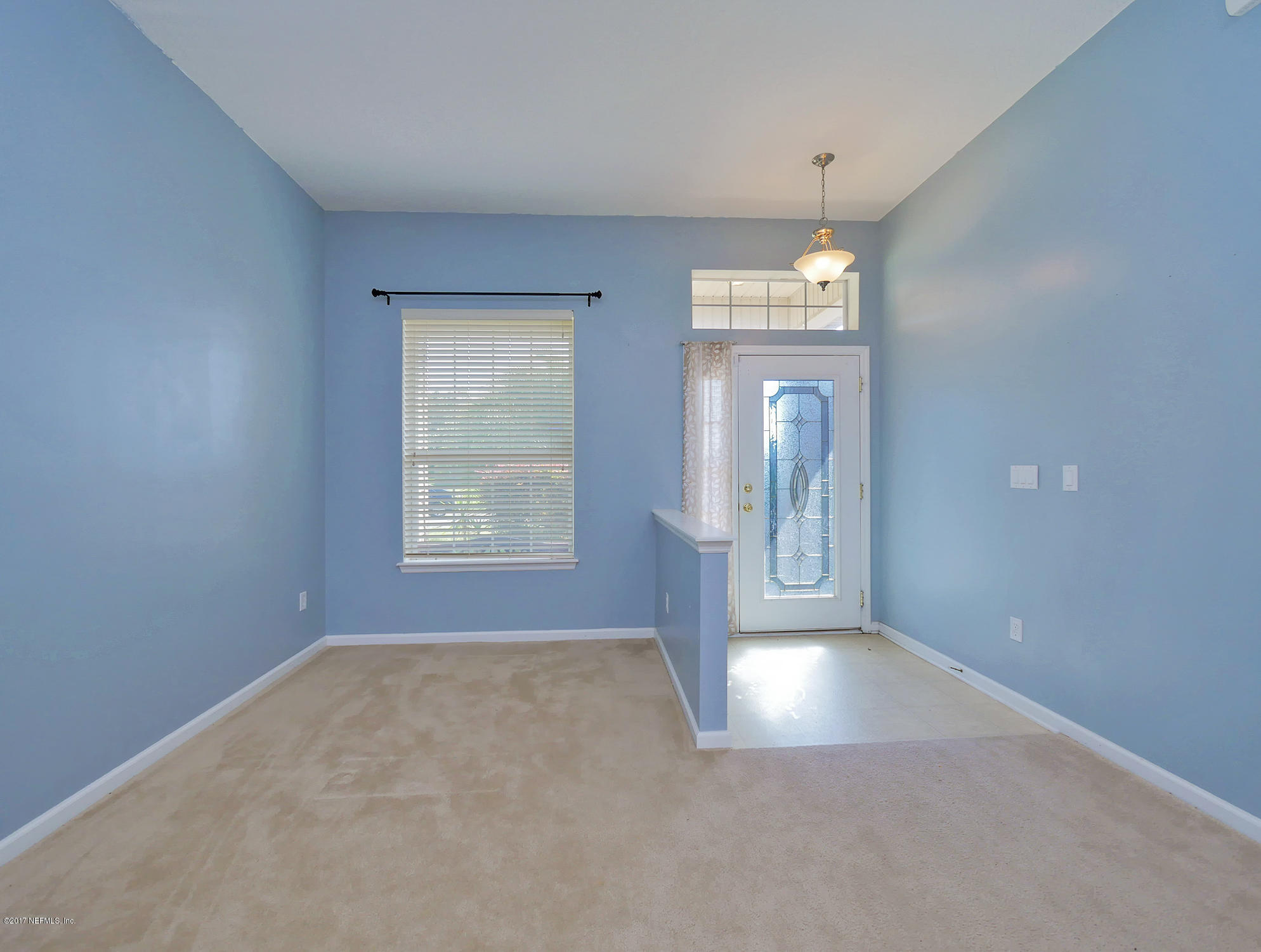 9146 Raptor Drive Jacksonville, FL 32221 - Photo 4 of 26 wooden floor in an empty room with a window