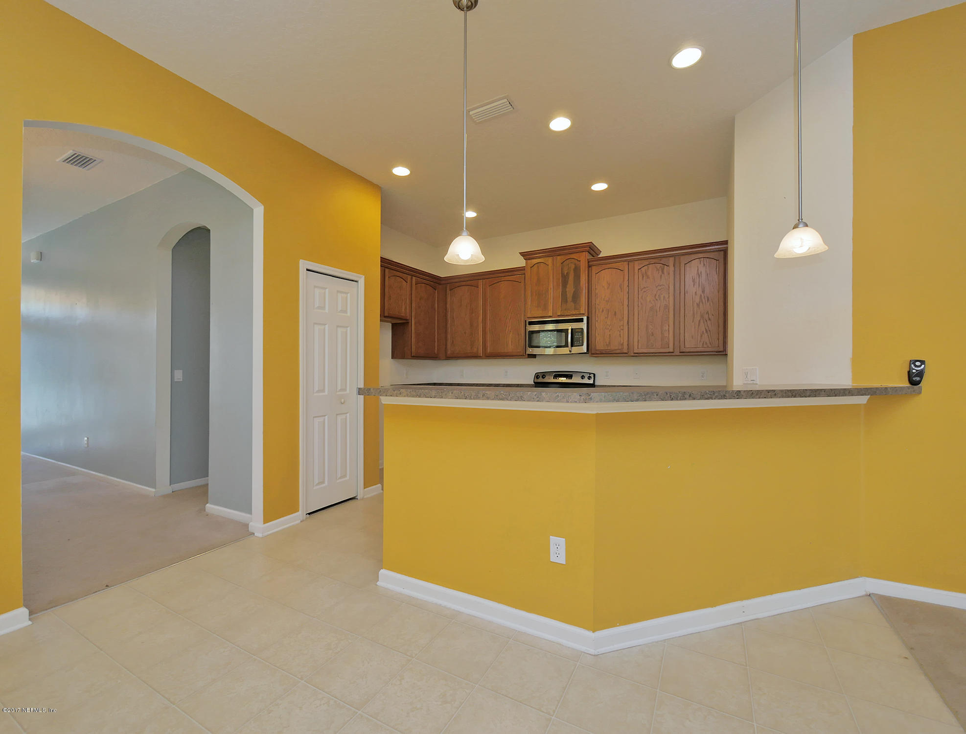 9146 Raptor Drive Jacksonville, FL 32221 - Photo 6 of 26 a view of a kitchen with a sink and cabinets