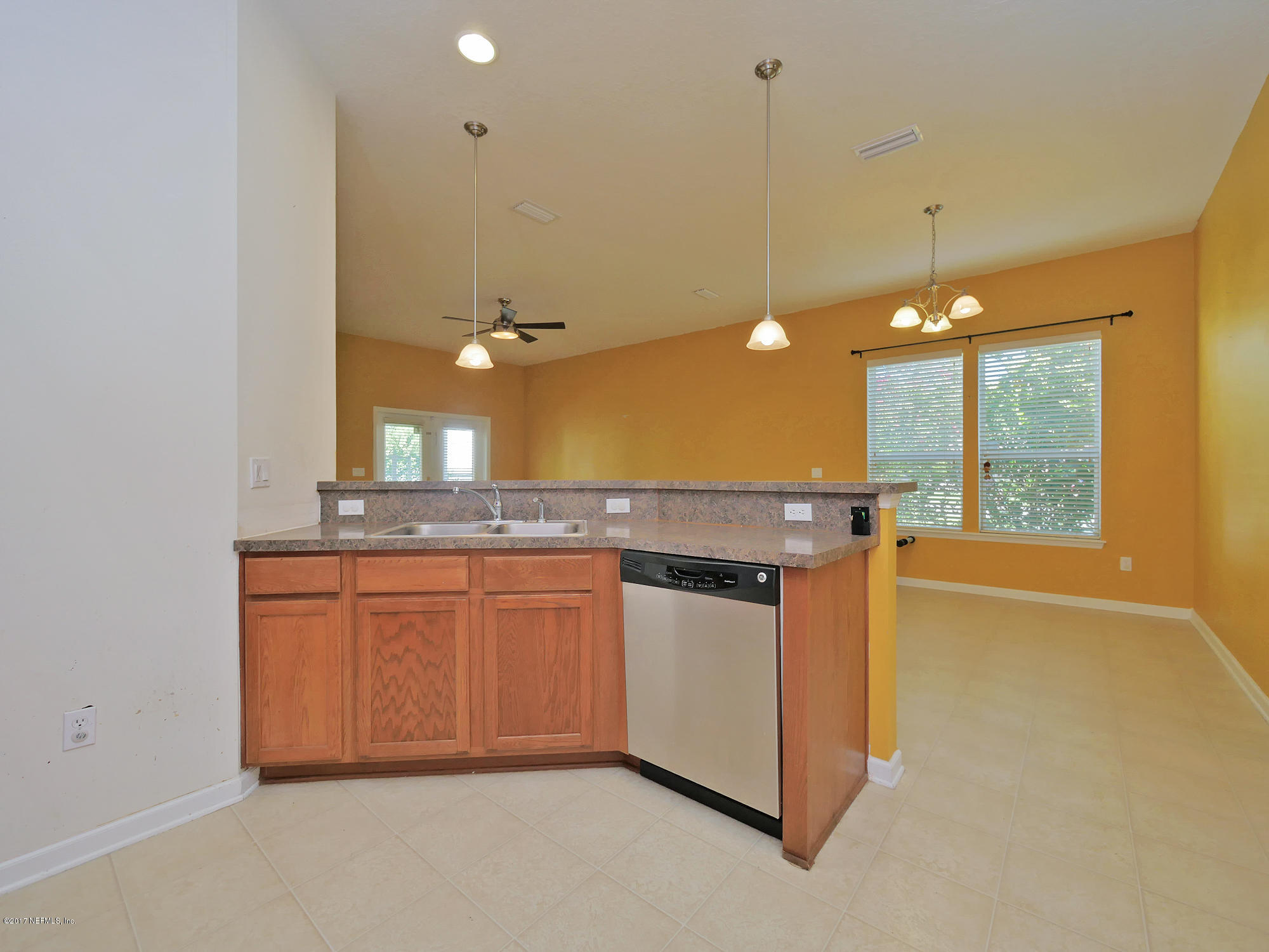 9146 Raptor Drive Jacksonville, FL 32221 - Photo 10 of 26 a bathroom with a sink a vanity and mirror